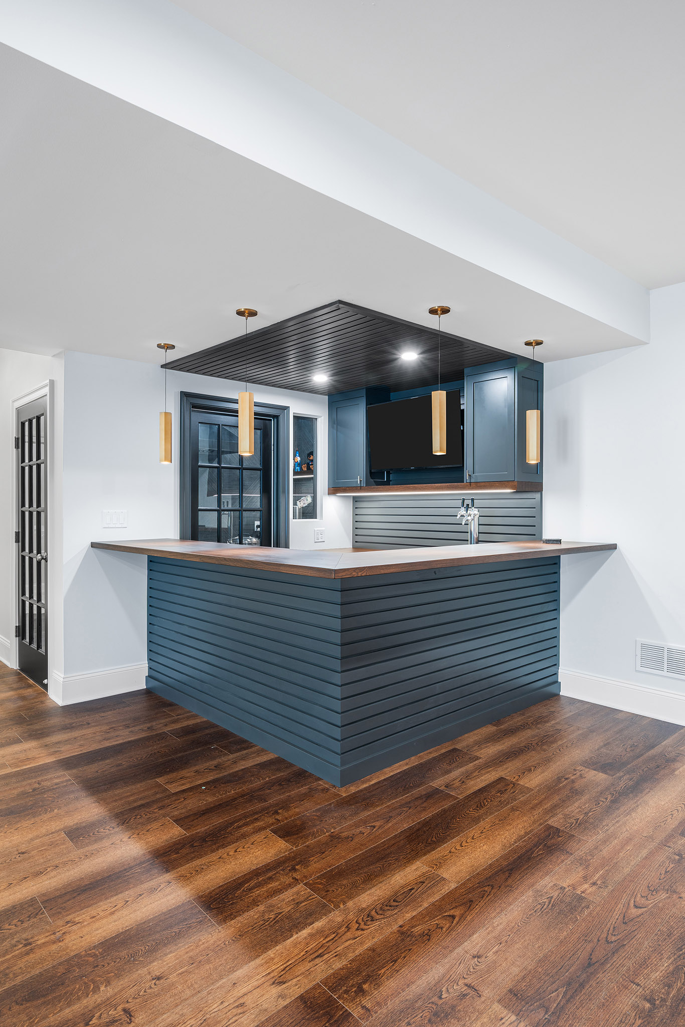 Domers Construction - Integrated and transformed unfinished garage and basement into indoor play area, mudroom, home gym, home brew bar, office, bathroom and bedroom